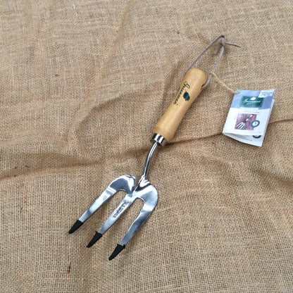 Weed fork with stainless steel forks on a hessian background